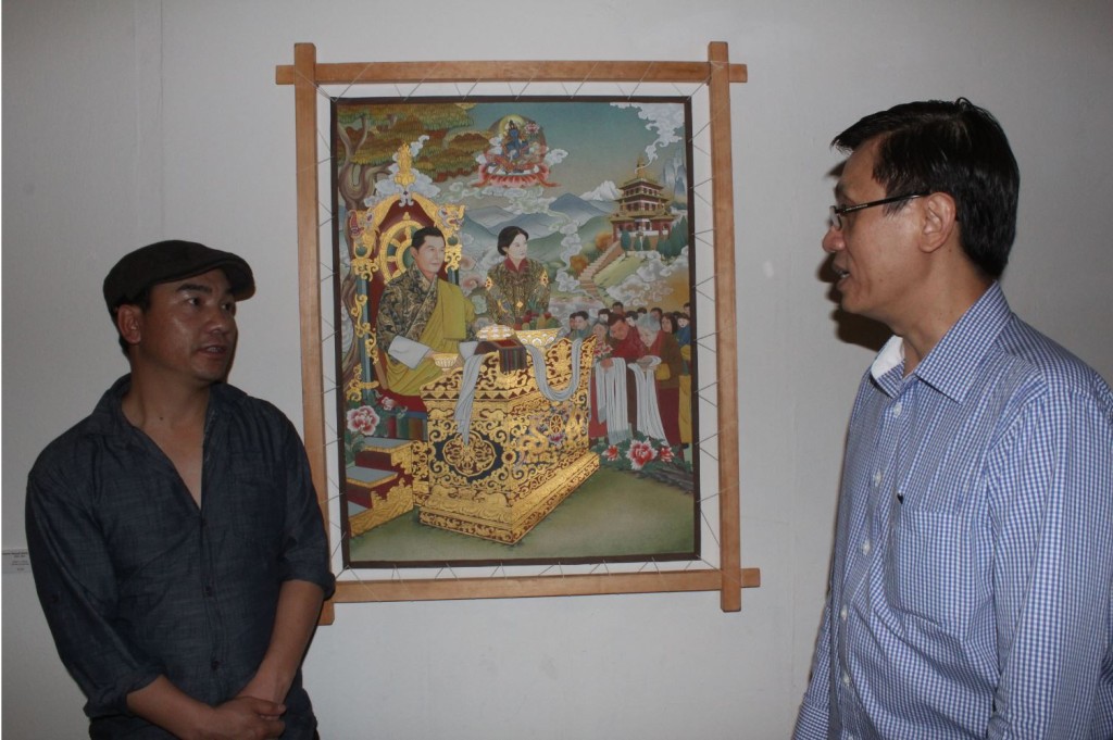 Rinchen Wangdi (at left) beside his painting "King"